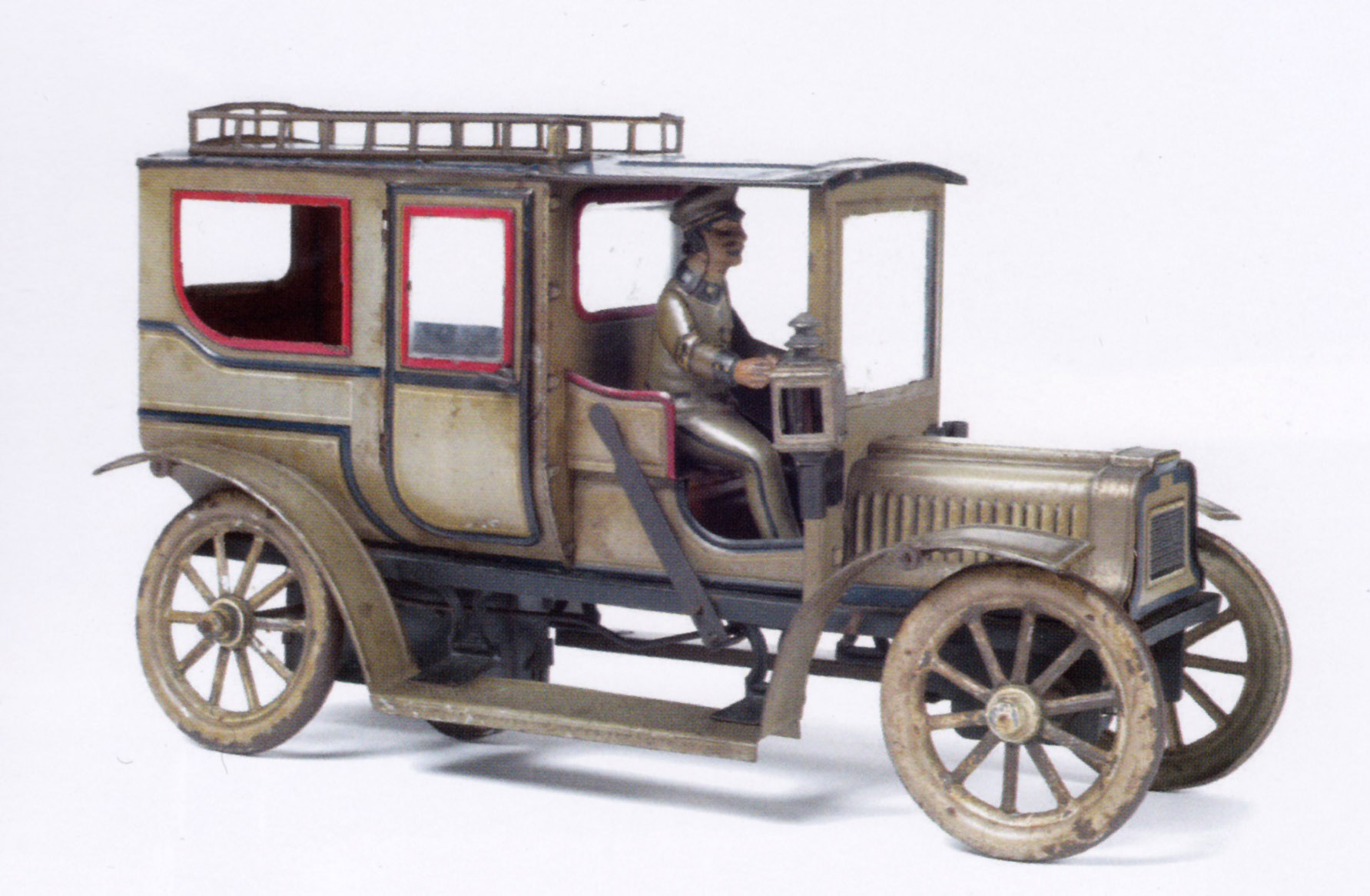 Limousine avec chauffeur en tôle peinte et lithographiée, Maison Carette, L. 31 cm